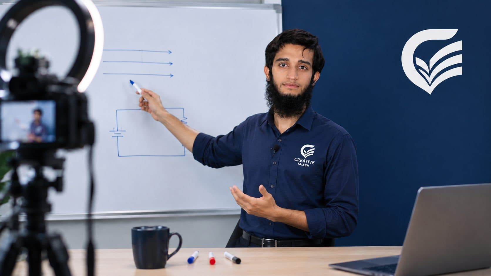 Gulraiz Hamza, founder of Creative Taleem, explaining a circuit diagram during a live class in the Creative Taleem studio
